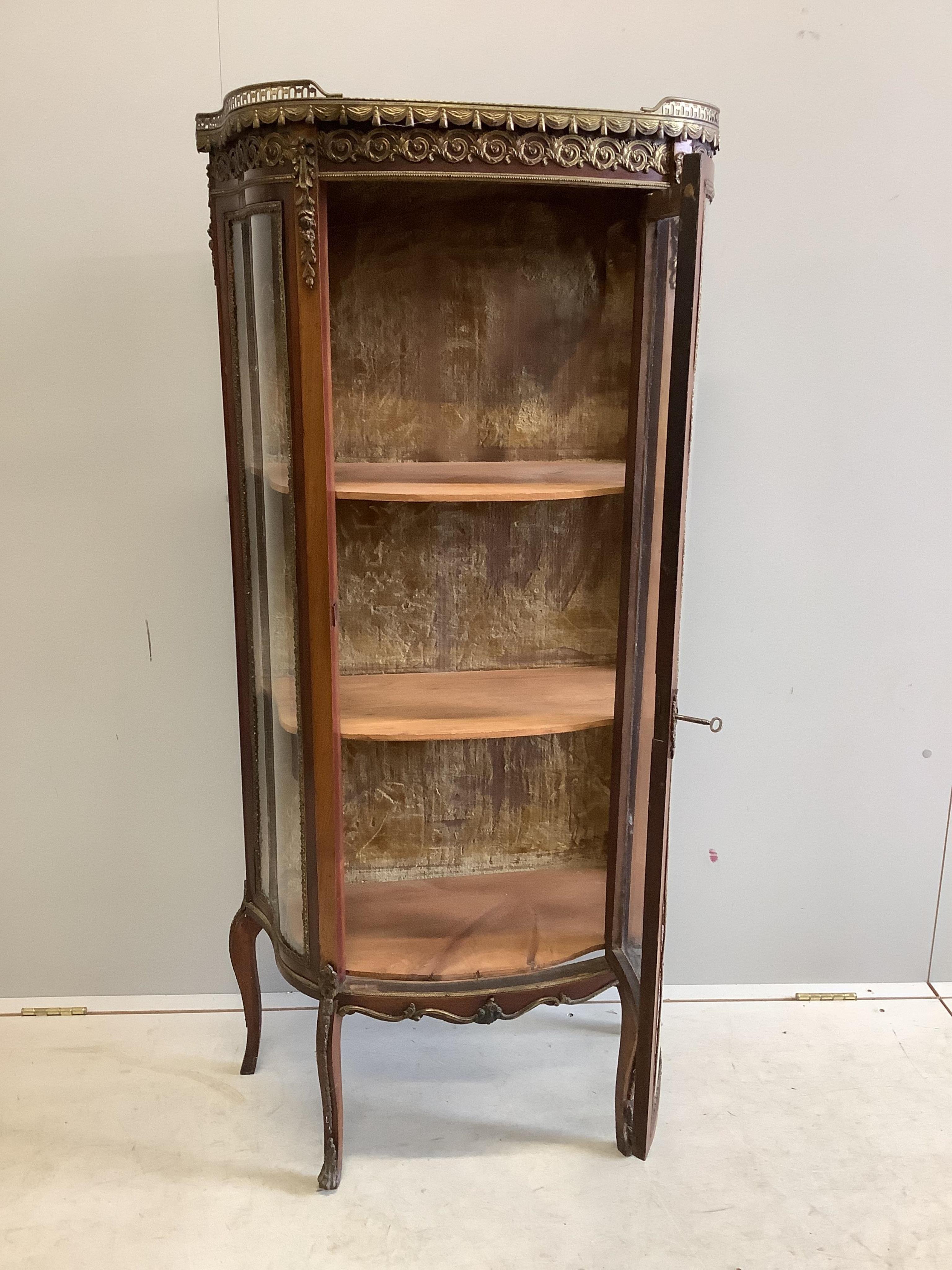 A French gilt metal mounted mahogany marble top vitrine, width 68cm, depth 32cm, height 142cm. Condition - fair